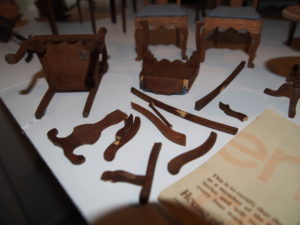 Broken miniature furniture in need of repair