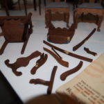 Broken miniature furniture in need of repair
